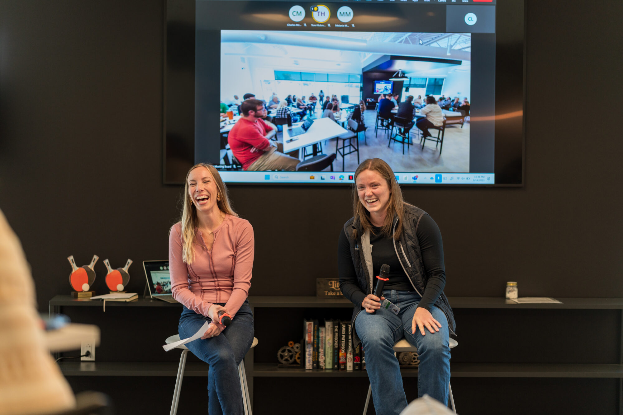 INCOG teammates present on a panel during a company meeting