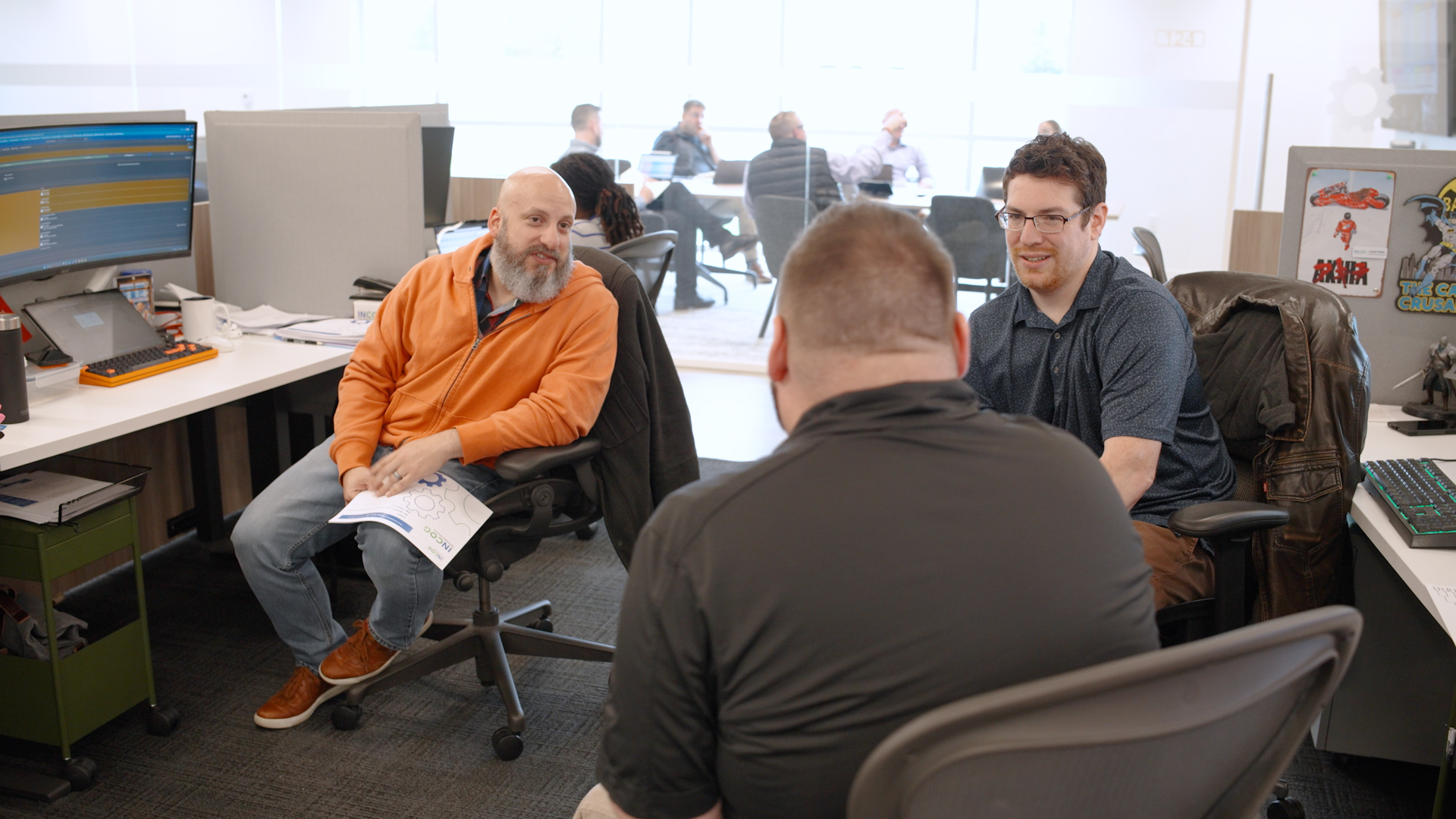 INCOG teammates collaborating at work