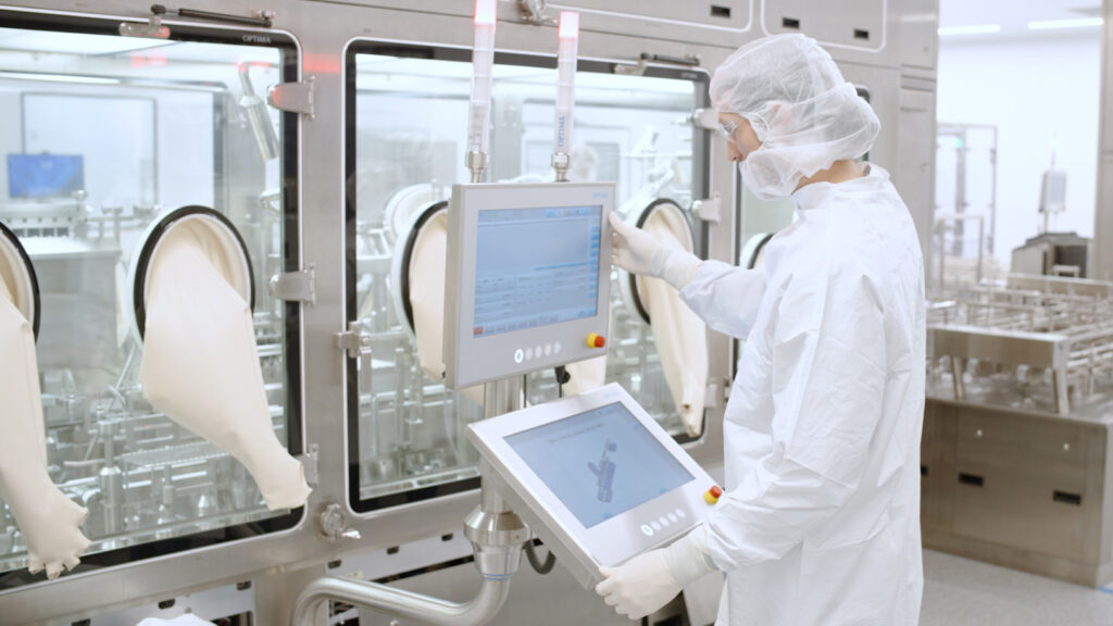 INCOG team member operates fill line equipment